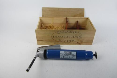 PORT: A ceramic novelty port flask in the form of a grease gun