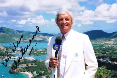 RICHIE BENAUD: A colour autographed picture of Richie Benaud depicted in his well renowned channel 9 uniform