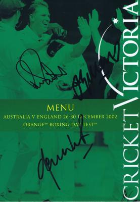 TEST CRICKET: A corporate seating menu from the Boxing Day Test 2002, autographed by Ricky Ponting, Jason Gillespie and Shane Warne on front cover