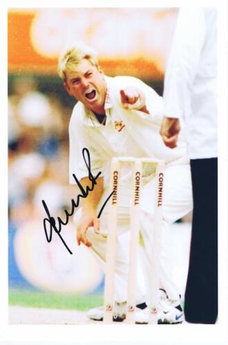SHANE WARNE: A colour picture featuring Shane Warne, appealing at the stumps, autographed by Shane Warne