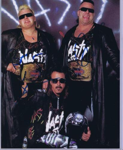 NASTY BOYS: A colour picture depicting the 'Nasty Boys' and Jimmy Hart, autographed by all three members