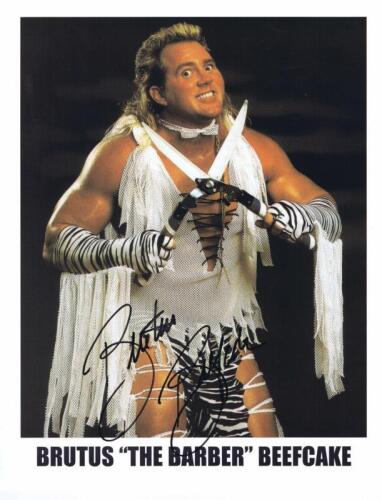 BRUTUS BEEFCAKE: A publicity card of Brutus Beefcake AKA 'The Barber' autographed by Brutus