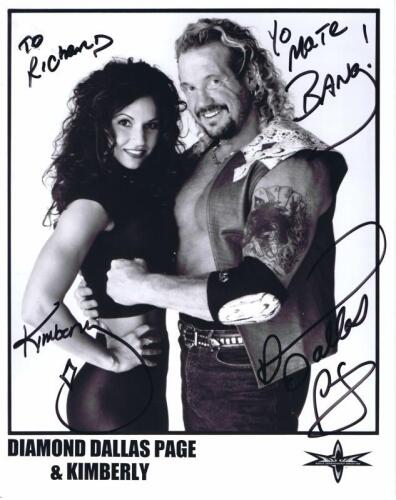DIAMOND DALLAS PAGE: A official WCW publicity card depicting Diamond Dallas Page and Kimberly, personally inscribed and signed by both