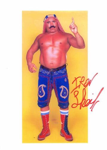 IRON SHEIK: A colour portrait depicting 'The Iron Sheik' with autograph