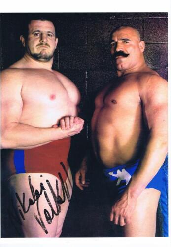 NIKOLAI VOLKOFF: A colour picture depicting Nikolai Volkoff and Iron Sheik, autographed by Volkoff