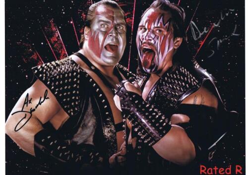 DEMOLITION: A colour picture featuring Ax & Smash as Demolition, autographed by both