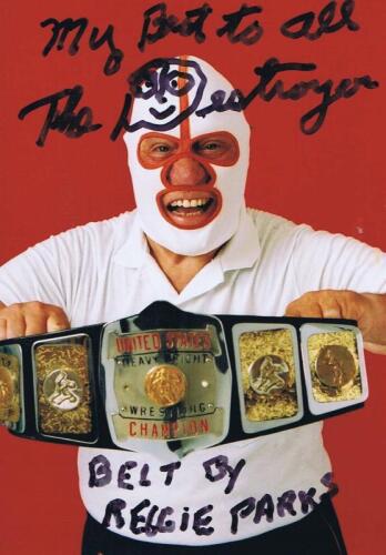 THE DESTROYER: A colour picture of 'The Destroyer' holding the Heavyweight Wrestling Champion Belt, autographed