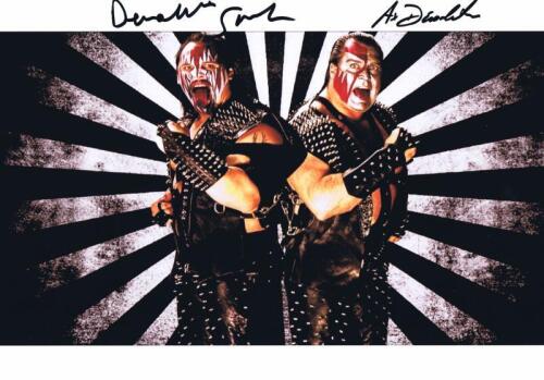 AX & SMASH: A colour photo depicting Ax & Smash, autographed by both