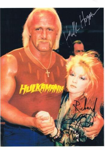 CYNDI LAUPER & HULK HOGAN: A colour picture depicting Cyndi and Hogan, personally signed and inscribed by both