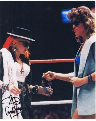 CYNDI LAUPER: A colour picture depicting Cyndi Lauper and Wendi Richter, autographed by Lauper