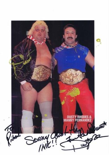 DUSTY RHODES: A colour picture featuring Dusty Rhodes and Manny Fernandez, personally inscribed and signed by Dusty Rhodes