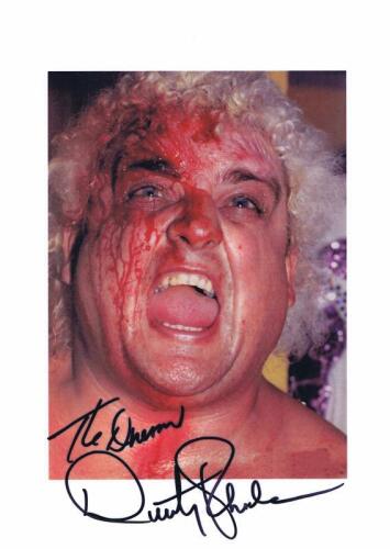 DUSTY RHODES: A colour picture depicting Dusty Rhodes with some 'Colour' on his forehead. Autographed