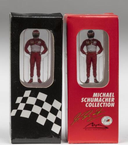 IRVINE/SCHUMACHER: Two 1:43 scale PAUL'S MODEL ART figurines of Eddie Irvine and Michael Schumacher from 1998