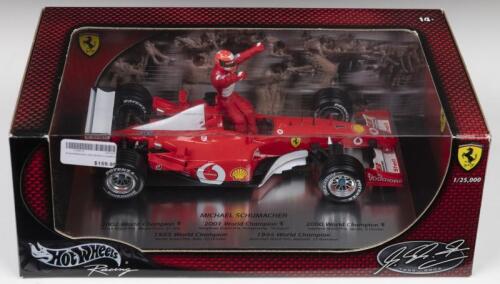 F-2002: A 1:18 scale Limited Edition Hot Wheels Racing edition displaying the Ferrari F-2002 of Michael Schumacher celebrating his 2002 Formula 1 World Championship (54614). Limited Edition of 25,000