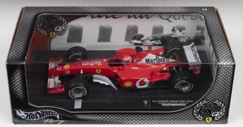 F-2002: A 1:18 scale Limited Edition Hot Wheels Racing edition displaying the Ferrari F-2002 of Michael Schumacher celebrating '150 FERRARI GRAND PRIX WINS' after taking victory at 2002 Canadian Grand Prix (54646). Limited Edition of 15854/20,000