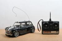 OVER MINI COOPER: A 1:10 scale radio control Mini Cooper front wheel drive racing car by TAMIYA