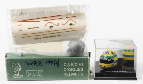 HELMETS: Two 1/12th scale model helmets. ONYX Ayrton Senna helmet in 'RENAULTelf&nbsp;NACIONAL'&nbsp;livery&nbsp;(HF002) & FOS Alan Jones white metal helmet