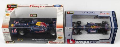 RED BULL: Two scale model of Red Bull Formula 1 cars by Bburago. 1:32 scale 2011 Red Bull Team Mark Webber