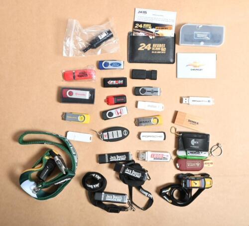 USB STICKS: An assortment of USB sticks from various motor racing events and racing teams. 'CATERHAM F1 TEAM', 'LOTUS F1 TEAM' USB sticks