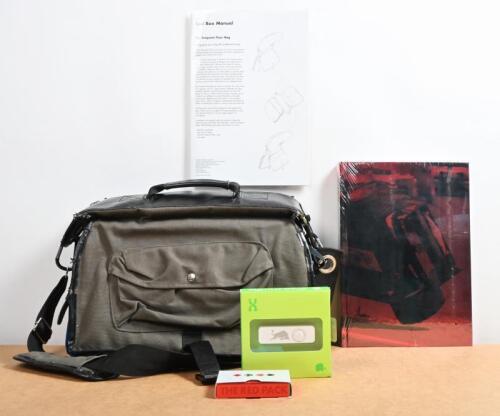 RED BULL: A circa 2006 Red Bull "Frequent Flyer Bag" as created by designer Tino Valentinitsch. Limited Edition bag designed for the F1 community. With accessories