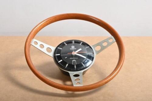 TISSOT CLOCK: A TISSOT (electronic) wood rim, three drill spoke steering wheel electronic clock (19cm overall diameter) working order