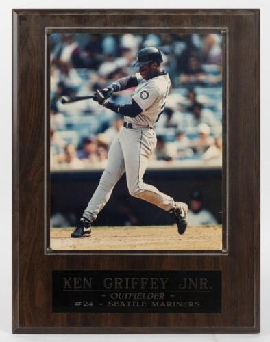 KEN GRIFFEY JNR: A framed official photograph of Ken Griffey Jnr, photograph behind perspex mounted onto board