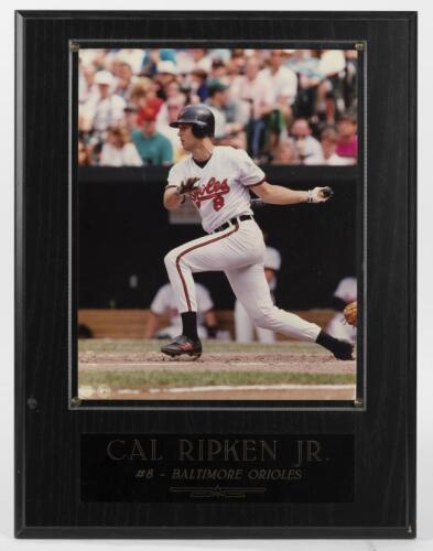 CAL RIPKEN JR: A framed official photograph of Cal Ripken Jr, photograph behind perspex mounted onto board
