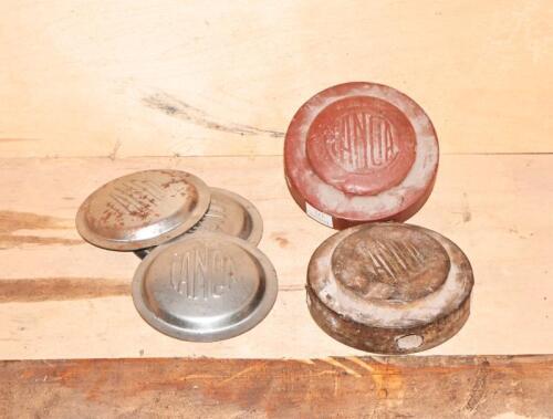 SPARE WHEEL: Two spare wheel locking nuts plus three pressed metal caps