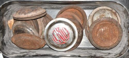 CAPS: A collection of pressed metal caps, some stamped Lancia