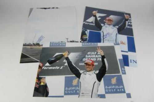 JENSEN BUTTON: Three signed large professional photographs of Jensen Button winning the 2009 Bahrain GP