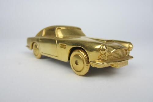 ASTON MARTIN: A 1:43 scale gold metal DB5.