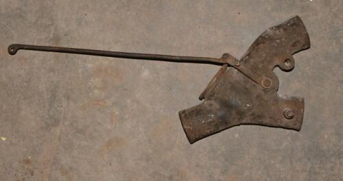 EXHAUST CUT OUT WITH OPERATING ROD: A cast iron exhaust cutout