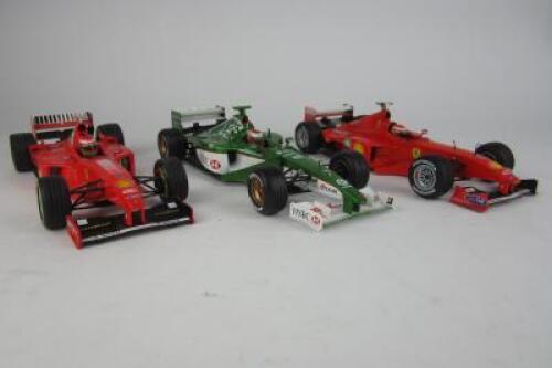 IRVINE: Three 1:18 scale model F1 cars as raced by Eddie Irvine
