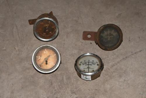 GAUGES: Four various oil and amps gauges