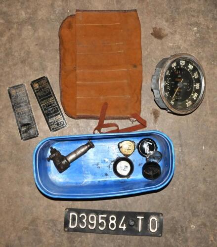 AURELIA B20: One box containing,one speedometer assembly in km per hour, two NOS oil instruction plates, one gearbox speedo drive, four Lancia horn button badges, one Italian number plate, and one canvas tool roll bag.