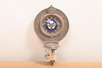 RACV: A circa 1930/40s Royal Automobile Club Associate (RACV) double sided silver plated car grille badge by Stokes & Sons, Melbourne