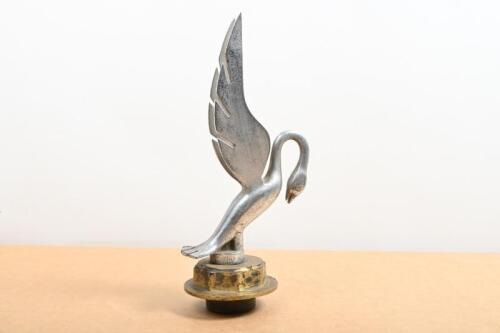 SWAN: A large swan figure mounted onto a brass radiator cap