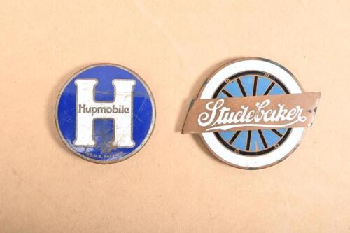 HUPMOBILE/STUDEBAKER: Two enameled badges including a blue and white enameled Hupmobile&nbsp;badge and a Studebaker badge