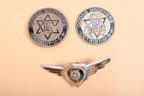 DODGE BROTHERS: Three Dodge Brothers badges including two round enameled badges and one Dodge Brothers crest grille badge
