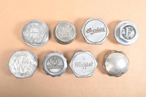 GREASE CAPS: A group of wheel grease caps including Willy's Knight, Overland, Whippet, Durant, Anderson and three others