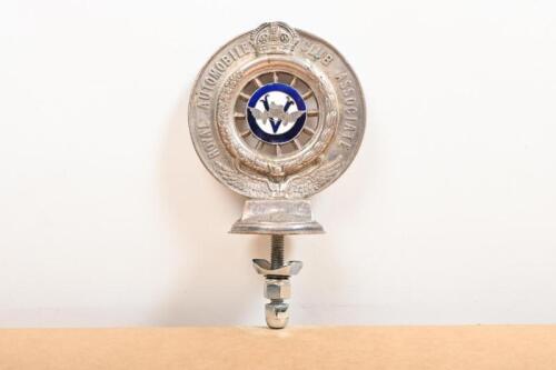 RACV: A late 1910s Royal Automobile Club of Victoria (RACV) Associate enamelled nickel plated brass car badge by Stokes and Son, Melbourne, enamel centres with associate emblem and Victorian flag, membership number 943, 10cm diameter