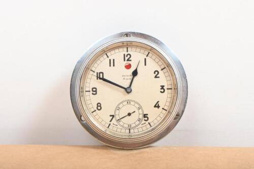 ZENITH: A high quality Zenith 8 day rim wind dashboard clock, nickel plated with bevelled glass, 9cm diameter