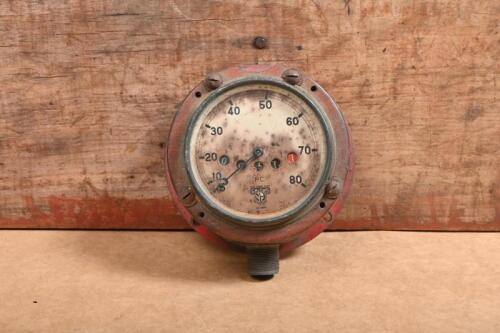 SMITHS: A Smiths 0-80 speedometer mounted in a heavy metal casing