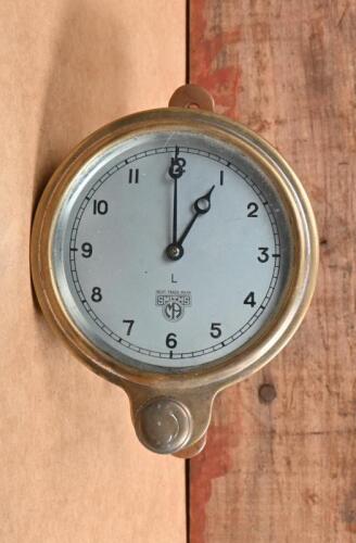 SMITHS: A early Smiths front wind dash clock in brass casing