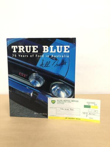 FORD/MOFFAT: A hardcover book "True Blue, 75 Years of Ford in Australia" by Bill Tuckey, signed to the front cover by Allan Moffat together with a receipt&nbsp;from Allan Moffat Service for the book purchase, very nice