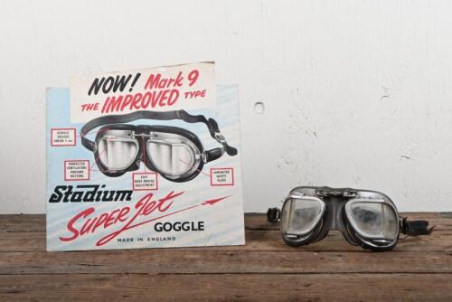 GOGGLES: A pair of circa 1960s Stadium 'Super Jet' racing goggles with embossed advertising cardboard sign