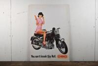 VINCENT/CHIKO: An original advertising poster featuring a lady eating a chiko roll on a Vincent Rapide motorcycle, mounted on thick gauge card, 79 x 55cm