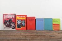 MOTORCYCLE MAINTENANCE/RESTORATION: A collection of hardcover books detailing motorcycle maintenance and restoration including 'HOW TO RESTORE YOUR BMW MOTORCYCLE: TWINS 1950-1969' by Roland Slabon.