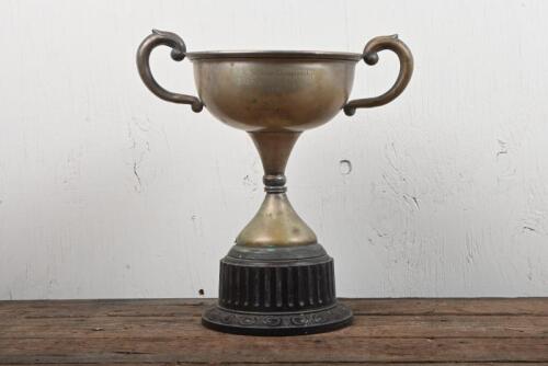 SPEEDWAY: A 1949 NSW Sidecar Championship Trophy won by Jack Carruthers on a Vincent HRD, silverplate on Bakelite stand, 32cm high, silverplate has mostly been rubbed off
