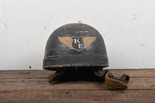 HELMET: An early "Cromwell Protector Helmet" with central winged "KE" emblem, leather straps and interior, surface damage to top